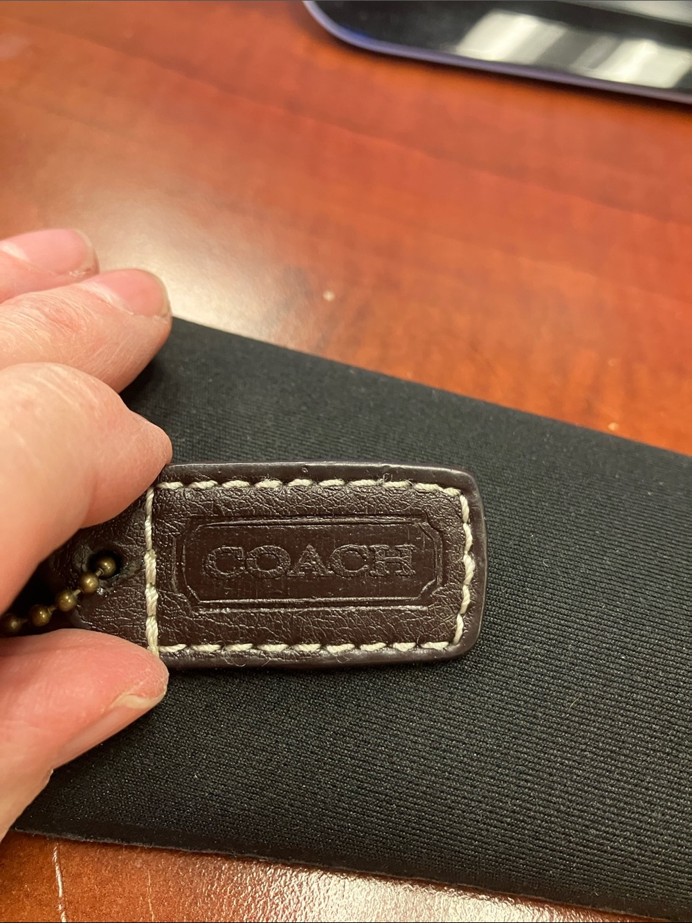 Coach Dark Brown Hang Tag with white stitching